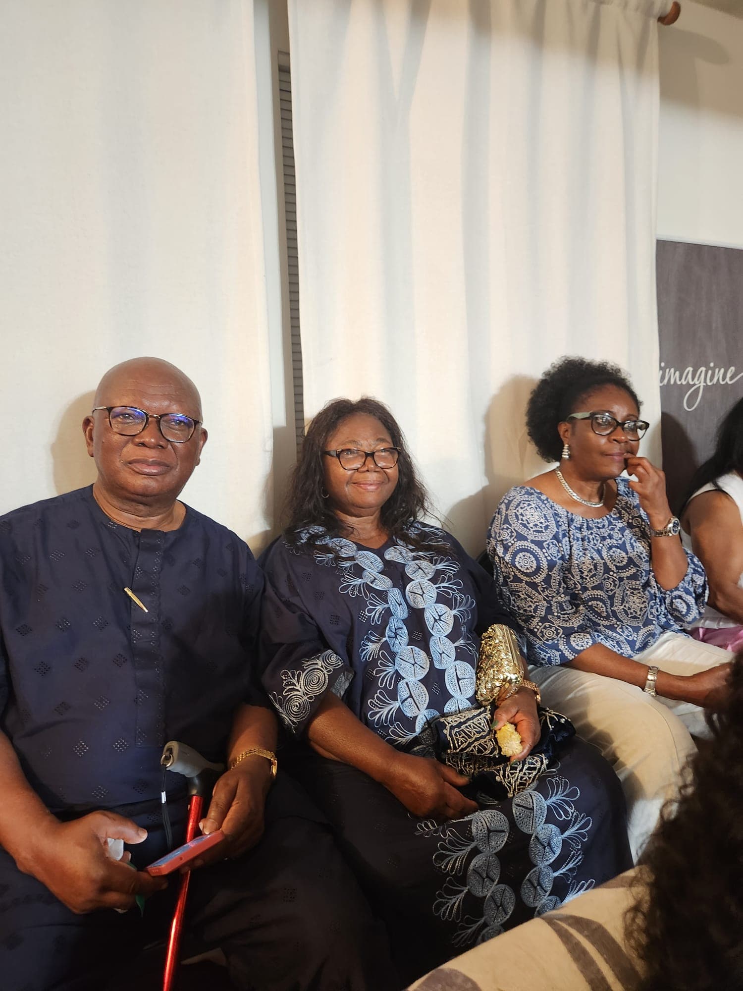 Three members seated side by side