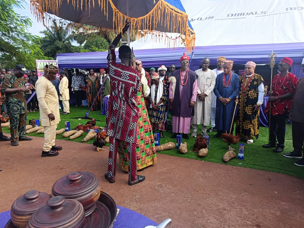 Egbu community members in traditional attire gathered at an outdoor ceremony