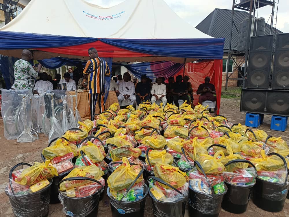 Rows of relief baskets lined up under a canopy, ready to be handed out to the community